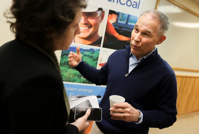 FILE- In this March 29, 2018, file photo, EPA Administrator Scott Pruitt talks with local media following a press conference after taking a tour of the Black Thunder coal mine outside of Wright, Wyo. Pruitt moved to roll back environmental regulations affecting many industries. Pruitt proposed last year to repeal a key climate-change regulation of President Barack Obama’s administration, which aimed to reduce emissions of carbon-trapping gases from coal-fired power plants. (Josh Galemor/The Casper Star-Tribune via AP, File)