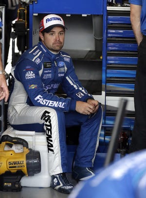 Ricky Stenhouse Jr., sits in his garage during a practice session for the NASCAR Cup Series auto race at Chicagoland Speedway in Joliet, Ill., Saturday, June 30, 2018. (AP Photo/Nam Y. Huh)
