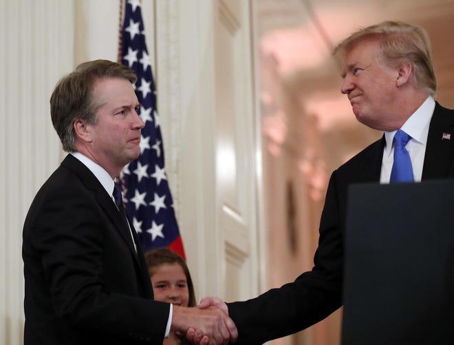 President Donald Trump shakes hands with Judge Brett Kavanaugh his Supreme Court nominee, on Monday in the East Room of the White House. [AP Photo/Alex Brandon]