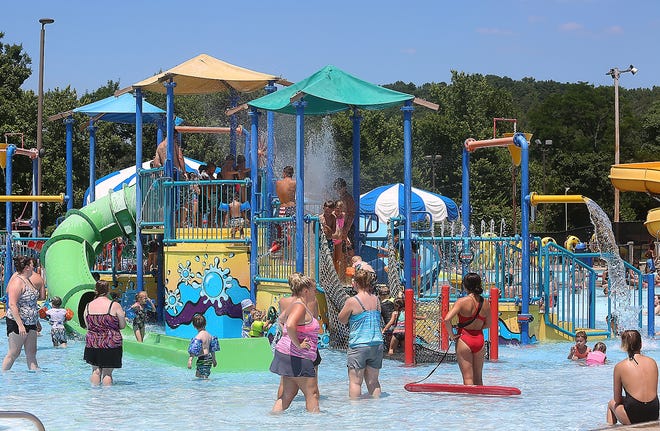 A large crowd enjoys the kiddie area at the Uhrichsville Water Park Monday. (TimesReporter.com / Jim Cummings)