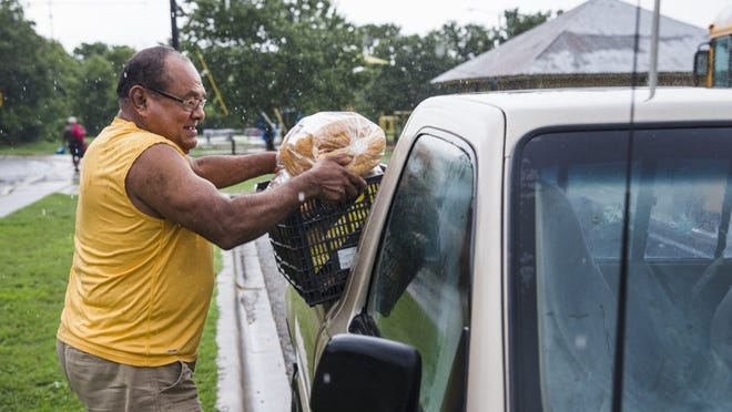 Manuel Ramirez, 67, loads his truck with groceries distributed by the Hays County Food Bank at the Dunbar Recreation Center on Monday. The food bank saw one of its most severe shortages in at least five years at the end of last month but has since received an outpouring of donations.