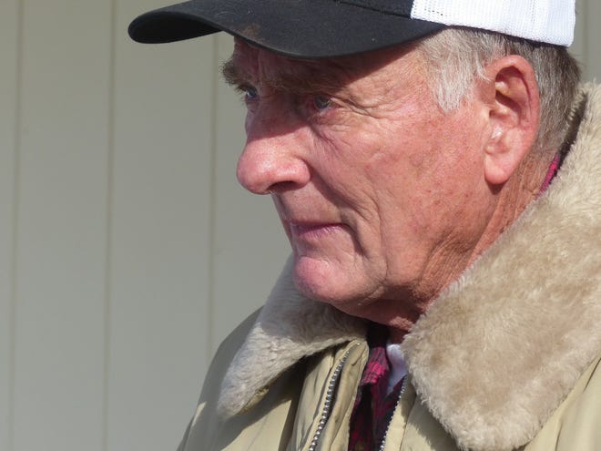 In this Jan. 2, 2016 photo, rancher Dwight Hammond Jr. greets protesters outside his home in Burns, Ore. President Donald Trump has pardoned Dwight and Steven Hammond, two ranchers whose case sparked the armed occupation of a national wildlife refuge in Oregon. The Hammonds were convicted in 2012 of intentionally and maliciously setting fires on public lands. [Les Zaitz/The Oregonian via AP, File]