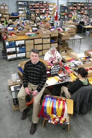 Rick Hodges, owner of Hodges Badge Co. in Portsmouth, is shown at the company in March 2013. [DAILY NEWS FILE PHOTO]