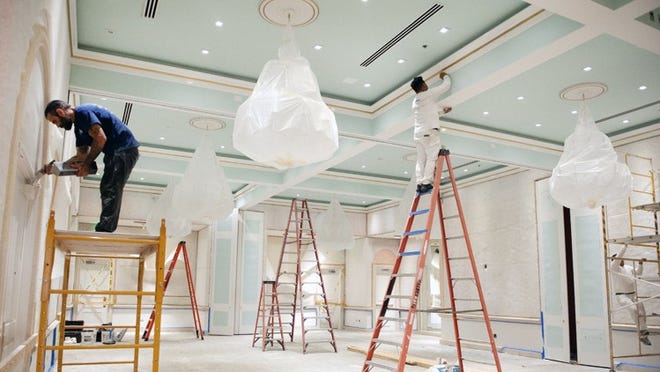 Workers prepare The Colony’s Coral Ballroom, the space formerly called the Pavilion, for new trim on June 28, 2018. This is the first step in renovations planned by owners Sarah and Andrew Wetenhall. (Meghan McCarthy / Daily News)