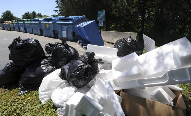 A pile of trash dumped next to the recycling bins outside the Middle Smithfield Township Building on Tuesday, July 10, 2018. Continued illegal dumping has caused the Monroe County Municipal Waste Authority to close the recycling site. [KEITH R. STEVENSON/POCONO RECORD]