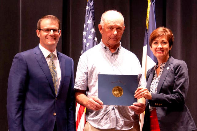 Richard Rogers of Woodward receives a Governor’s Volunteer Award from Lt. Gov. Adam Gregg and Gov. Kim Reynolds during a special recognition ceremony held June 10. PHOTO SUBMITTED TO THE PERRY CHIEF