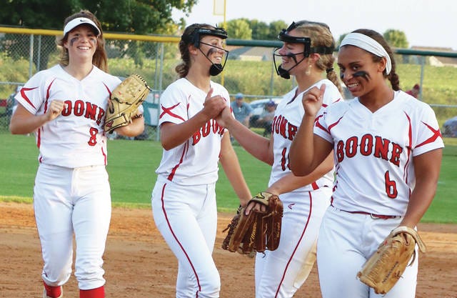 Boone’s softball team experienced emotional extremes during the Regional tournament, celebrating a 12-2 win over Webster City in its postseason opener. Jordan Trowbridge, Emily Ades, Emma Dighton and Caitlynne Shadle broke into smiles after the final out. Photo by Andrew Logue/News-Republican