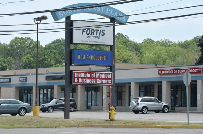 The sign for Fortis Institute and the Institute of Medical & Business Careers is shown along West Ridge Road on Tuesday in front of the Fairview Township campus that both trade and career schools share. Fortis is in a dispute with its landlord to stay at the properties at the same time Fortis is in a fight to keep its accreditation as a for-profit trade and career school. [CHRISTOPHER MILLETTE/ERIE TIMES-NEWS]