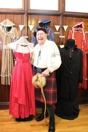 Don Crawford poses with Kings Mountain Centennial Dress (worn by Evelyn Hamrick) on display. [PHOTOS COURTES OF THE KINGS MOUNTAIN HISTORICAL MUSEUM]