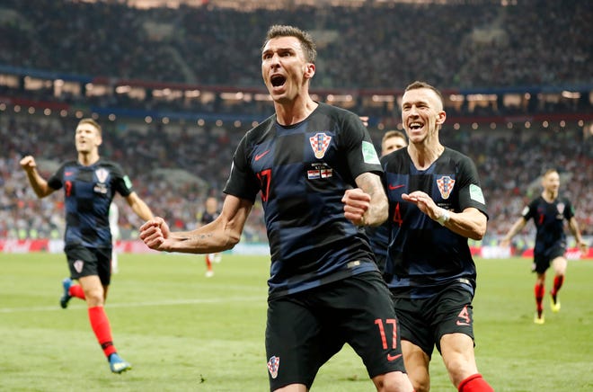 Croatia's Mario Mandzukic celebrates after scoring what proved to be the game-winning goal in the second half of Croatia's 2-1 World Cup semifinal win over England on Wednesday in Moscow. [AP Photo/Frank Augstein]