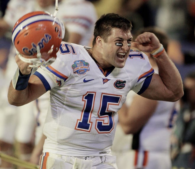 Florida quarterback Tim Tebow celebrates during the fourth quarter of the 2008 BCS Championship game against Oklahoma in Miami. Tebow will be inducted into UF's Ring of Honor on Oct. 6. [File]