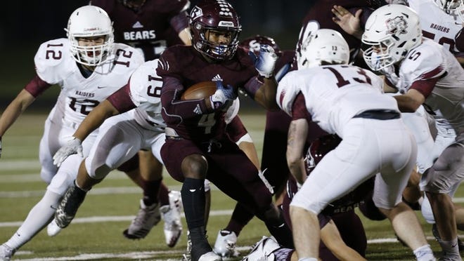 Bastrop’s Jhe’Quay Chretin (4) looks to get around Rouse’s Chance Canalas (12), Derek Galloway (19), Cole Bresenhen (13) and Lane Bresenhen (5) during a District 19-5A high school football game at Bastrop Memorial Stadium, Friday, Nov. 10, 2017. The return of Chretin will help Bastrop return to the playoffs in a revamped district. according to Dave Campbell’s Texas Football. (Stephen Spillman / for American-Statesman)