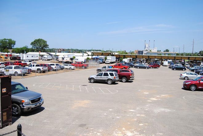 The parking lot in front of the Civic Center is shown on Wednesday, July 11 during the Holland Farmers Market. Construction of outdoor elements of the Civic Center have begun to impact the amount of parking in front of the building. [Austin Metz/Sentinel Photo]