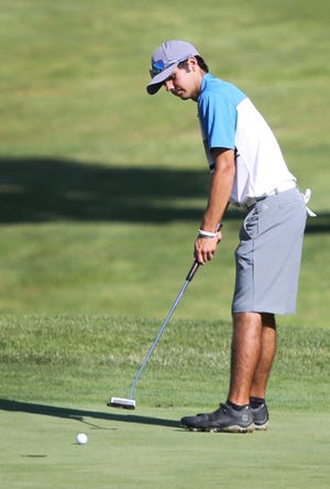 Gabe Miller of Dover makes a putt during the second round of the East Central Ohio Junior Classic Thursday at Oak Shadows Golf Course in New Philadelphia.(TimesReporter.com / Pat Burk)