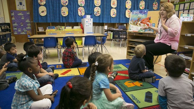 Prekindergarten teacher Kate Smith reads to her class last year at Lucy Read Elementary in North Austin. Last year, the Austin school district eliminated suspensions for pre-K to second-graders for most offenses.
