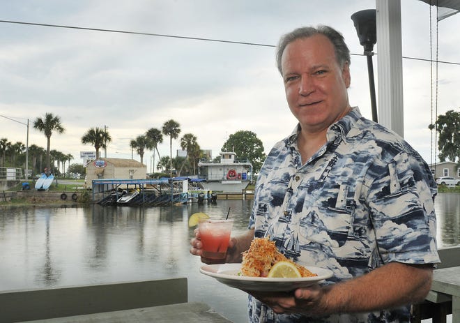 Jim Jordan, owner of Fish Camp on Lake Eustis in Tavares, has reopened six days after a tornado damaged the restaurant. For the occasion, he has created some new specials, including Shrimp Tornado and a Tavares Tornado. [Tom Benitez / Correspondent]