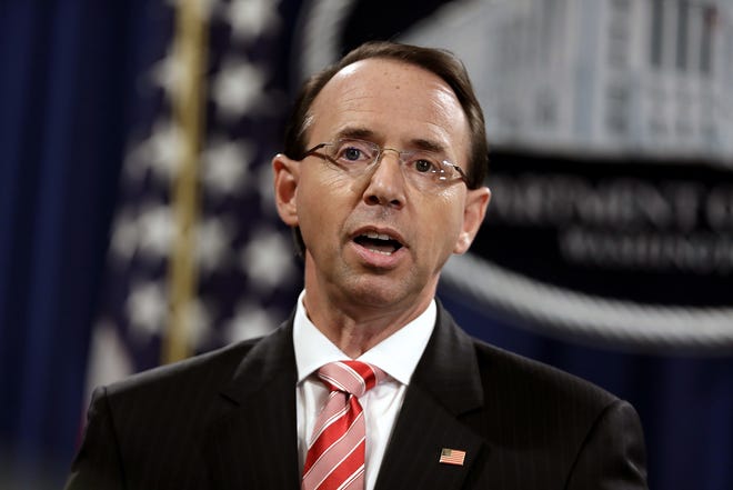 Deputy Attorney General Rod Rosenstein speaks during a news conference at the Department of Justice Friday in Washington. [EVAN VUCCI/ASSOCIATED PRESS]