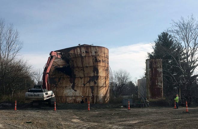 In this Dec. 11, 201, photo, a tank at a Kiel Bros. facility is torn down in Indianapolis. The collapse of Kiel Bros. Oil Co. in 2004 was widely publicized. Less known is that the state of Indiana and, to a smaller extent, Kentucky and Illinois, are still on the hook for millions of dollars to clean up more than 85 contaminated sites across the three states, including underground tanks that leaked toxic chemicals into soil, streams and wells. [BRIAN SLODYSKO/ASSOCIATED PRESS]