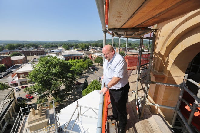 Community and Economic Development Director Scott Reynolds checks out the progress of the renovations to the Tuscarawas County Couthouse dome Wednesday in New Philadelphia.(TimesReporter.com / Pat Burk)