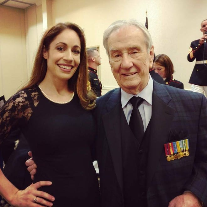 Jack Paxton, editor of the recently released Marine Corps anthology combat correspondents anthology, “First to Go,” is pictured with actress Jennifer Brofer, who is a former Marine Corps journalist. Jack died on April 17 just after review copies of his book were being shipped by the publisher. [Submitted]