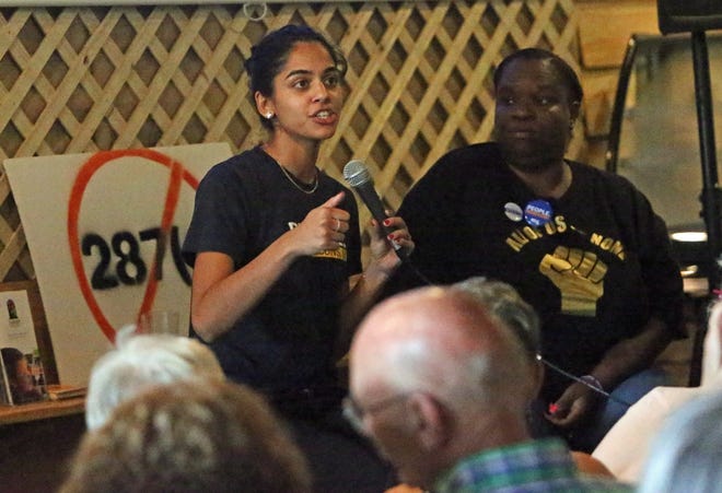 ACLU attorney Sneha Shah speaks at a forum Saturday on the cash bail system as Andrea "Muffin" Hudson looks on at Sanctuary Brewing Co. [ROB MOORE/Times-News]