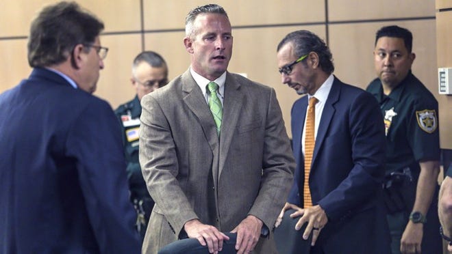 PBSO deputy Jason Nebergall appears shaken after he was found guilty of attempted sexual battery with a weapon and one count of battery stemming from a 2016 incident Friday, July 13, 2018. (Lannis Waters / The Palm Beach Post)