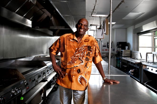 John Nelson, who retired in June as the executive chef in the soup kitchen at Amos House in Providence, stands in his former workplace at the social-services agency on Pine Street. [The Providence Journal / Kris Craig]