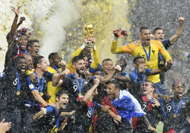 France goalkeeper Hugo Lloris lifts the trophy after France won 4-2 over Croatia in the finals of the World Cup on Sunday at Luzhniki Stadium in Moscow, Russia. [AP Photo/Martin Meissner]