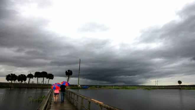 Dark storm clouds roll in over on the Paynes Prairie observation boardwalk on U.S. 441 in May near Gainesville.  [Alan Youngblood/Staff photographer/File]