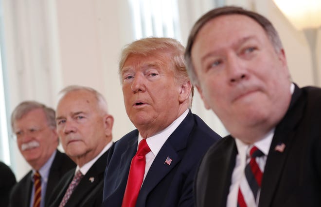 U.S. President Donald Trump, second right, is flanked by, from left, Security Adviser John Bolton, the US ambassador to Finland Robert Frank Pence and U.S. Secretary of State Mike Pompeo during a working breakfast with Finnish President Sauli Niinisto in Helsinki, Finland, Monday, July 16, 2018 prior to his meeting with Russian President Vladimir Putin in the Finnish capital. (AP Photo/Pablo Martinez Monsivais)