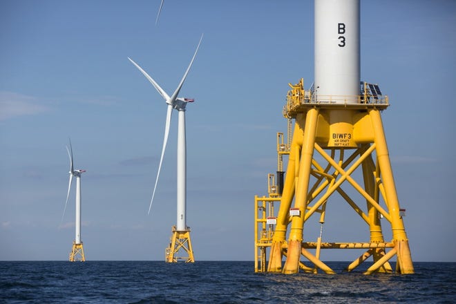 This 2016 file photo shows three of Deepwater Wind's turbines stand in the water off Block Island, R.I. [AP Photo/Michael Dwyer, File]