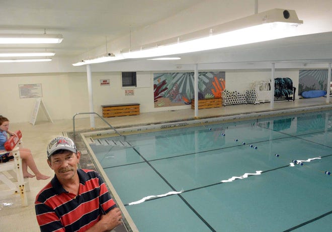 Kyle Collins, the Plainfield assistant building director, says all the fluorescent lights, including the ones at the swimming pool, at Plainfield Town Hall could soon be replaced with new LED lights based on an energy audit that recommends cost-saving measures. [John Shishmanian/ NorwichBulletin.com]