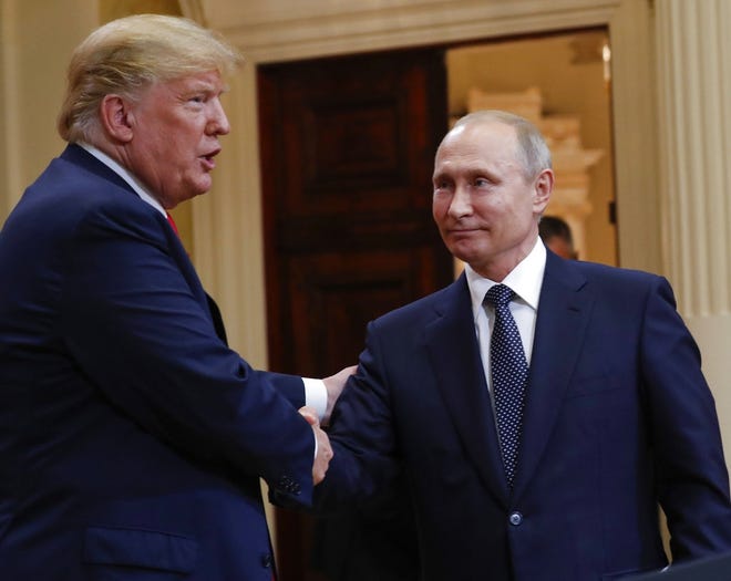 U.S. President Donald Trump, left, and Russian President Vladimir Putin, right, shake hands at the conclusion of their joint news conference at the Presidential Palace in Helsinki, Finland, Monday, July 16, 2018. (AP Photo/Pablo Martinez Monsivais)