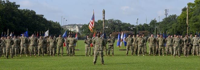 Members of the 3rd Combat Aviation Brigade stand at attention before a colors uncasing ceremony in Forsyth Park on Wednesday. The ceremony served to welcome the unit back to Hunter Army Airfield and its surrounding communities. The ceremony is an Army tradition that marks the movement of the brigade into a new theater of operation. While deployed, the brigade was recognized as Task Force Falcon, where soldiers provided aviation operations, logistics and medical evacuation support to the ground forces commander throughout Afghanistan. [Will Peebles/Savannahnow.com]
