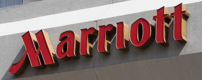 FILE - This Wednesday, March 23, 2016, file photo, shows a sign at a Marriott Hotel in Richmond, Va. Marriott International plans to remove plastic straws and drink stirrers from all of its 6,500 hotels and resorts worldwide by 2019. (AP Photo/Steve Helber, File)