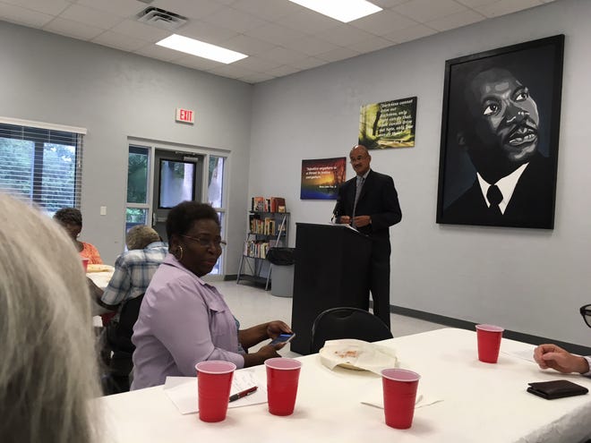 Alachua County Commissioner Chuck Chestnut addresses a Tuesday evening meeting of the Concerned Citizens of Newberry regarding lynching and other aspects of racism. [Photograph by Cindy Swirko]