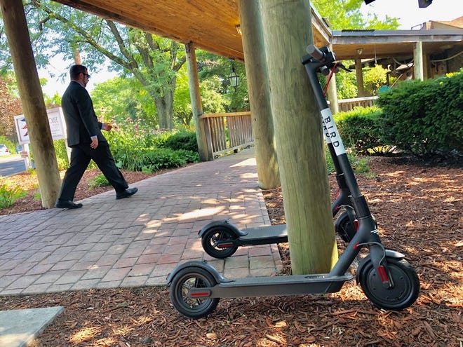 A Bird electric scooter is seen at the Boat House at confluence entrance. (Fred Squillante | Columbus Dispatch)
