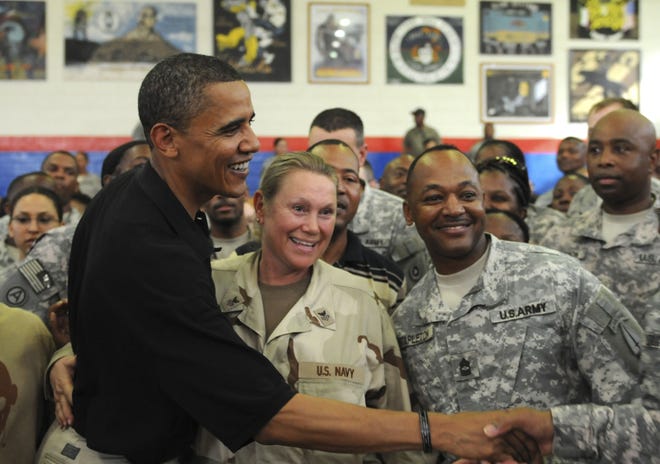 Democratic presidential candidate Sen. Barack Obama, D-Ill., shakes hands with service members July 19, 2008, at Camp Arifjan, Kuwait during a Congressional Delegation visit. [Jarod Perkioniemi/U.S. Army]