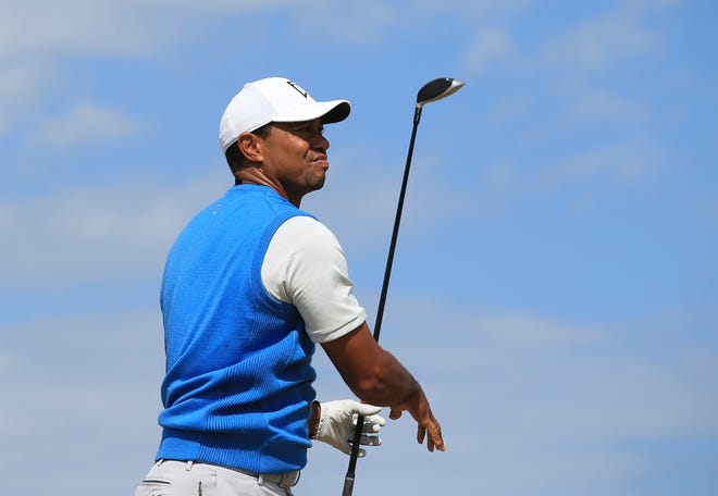 Tiger Woods plays off the fourth tee during the first round of the British Open Golf Championship in Carnoustie, Scotland. If Woods makes the cut the historic golf tournament will be one of the most watched events of the weekend. [THE ASSOCIATED PRESS / JON SUPER]