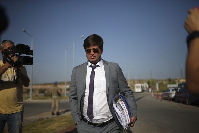 Ismail Cem Halavurt, the lawyer of jailed Andrew Craig Brunson who served as the pastor in Izmir, western Turkey, arrives at the prison complex in Aliaga, Izmir province, western Turkey, where his client is appearing on his trial at a court inside the complex, Wednesday, July 18, 2018. The 50-year-old evangelical pastor from Black Mountain, North Carolina, faces up 35 years in prison in Turkey on charges of "committing crimes on behalf of terror groups without being a member" and "espionage." [AP Photo/Emre Tazegul]