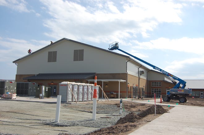 A construction crew at work on Surf City Middle School and Surf City Elementary School in Hampstead in April. The schools will open to Pender County students in August. [STARNEWS FILE PHOTO]