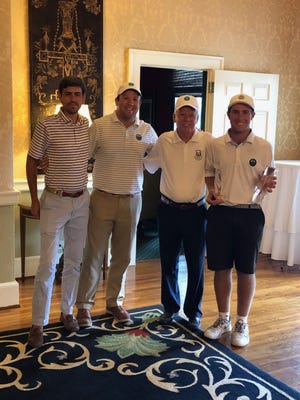 New Bern High School golfer Casey Osiecki (far right) stands with TYGA (Tar Heel Youth Golf Association) officials after winning the Roy Jones Junior Championship this week. [CONTRIBUTED PHOTO]