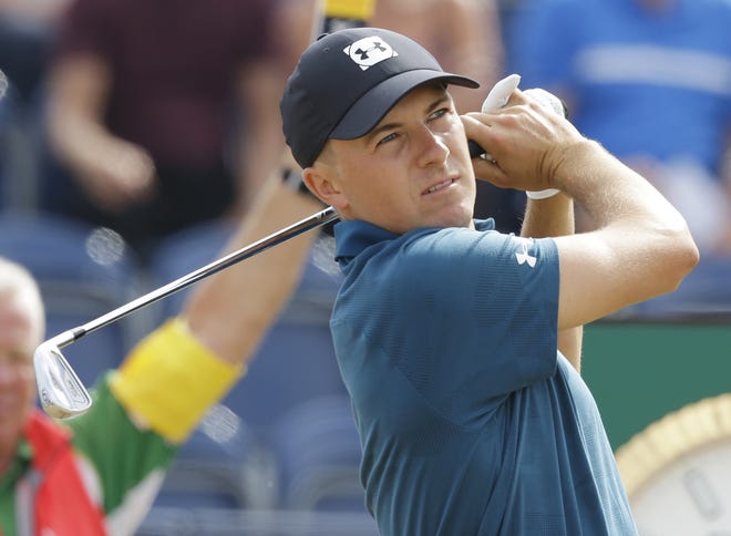 Jordan Spieth plays a shot off the third tee during the third round of the British Open Golf Championship in Carnoustie, Scotland, on Saturday. [AP Photo / Martin Cleaver]