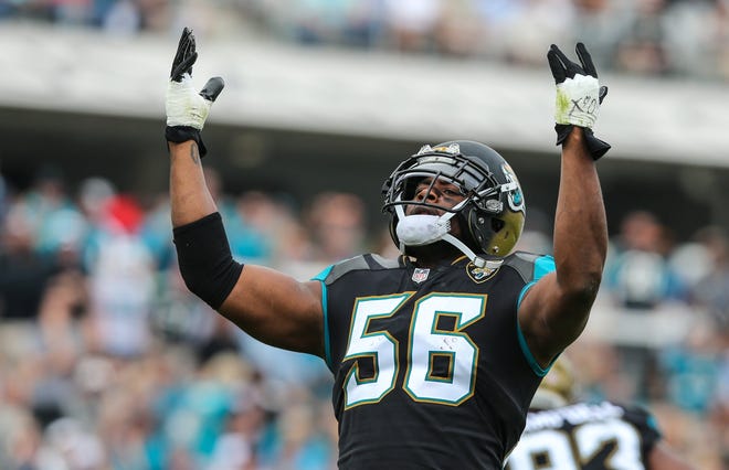 Jacksonville Jaguars defensive end Dante Fowler (56) raises his hands to the fans after the defense forces a Colts fourth down during the first half of an NFL football game at EverBank Field in Jacksonville, Fla., Sunday, Dec. 3, 2017. (For The Florida Times-Union/Gary Lloyd McCullough)