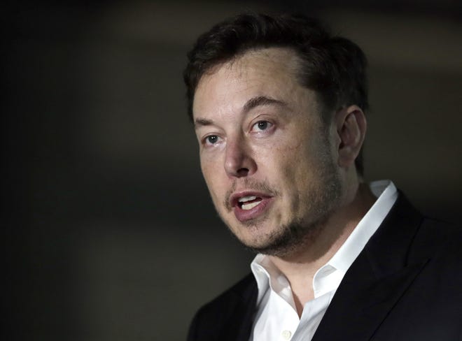 Tesla CEO Elon Musk will not be leaving his automobile firm to start a digital currency company. Stories circulating online that spread that rumor are untrue. [AP FILE PHOTO/KIICHIRO SATO]