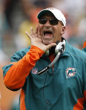 Miami Dolphins head coach Tony Sparano calls out a play during a game against the Buffalo Bills on Nov. 20, 2011, in Miami. Sparano died Sunday at age 56. [AP Photo / Hans Deryk]