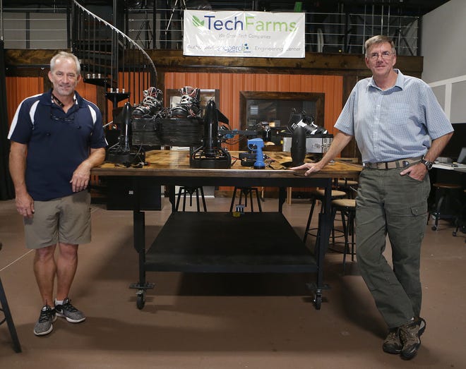 Jeff Elkins, left, stands for a photo with Tech Farms CEO Steve Millaway on July 5 at TechFarms. [PATTI BLAKE/THE NEWS HERALD]