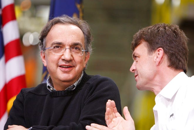 In this Friday, May 21, 2010 file photo, Chrylser CEO Sergio Marchionne, left, is seen with Jeep brand President and CEO Mike Manley at the Jefferson North Assembly Plant, in Detroit. Fiat Chrysler's board recommends Jeep executive Mike Manley to replace seriously ill CEO Sergio Marchionne, Saturday, July 21, 2018. (AP Photo/Carlos Osorio, File)