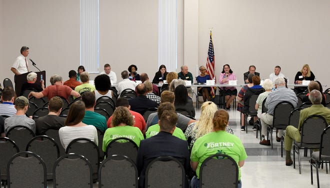 Voters listen to candidates' positions on key issues during a School Board Candidates Forum hosted by the Polk Education Association and the Polk Education Association-Retired at the Chain of Lakes Complex in Winter Haven on Tuesday. [SCOTT WHEELER/THE LEDGER]