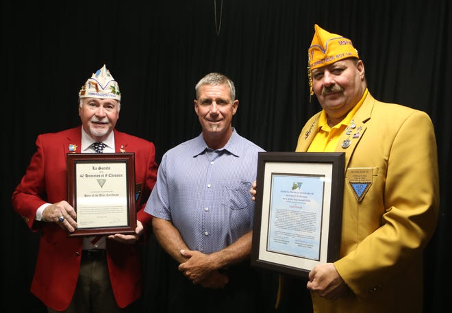 From left, local Chef de Gare of 40 & 8 Steve Dring, Todd Flitcraft and Grand Director of Special Awards Michael Klyap stand for a photo. Flitcraft won the local and state Hero of the Year award from the 40 & 8 on Monday at VFW Post 2185. [PATTI BLAKE/THE NEWS HERALD]